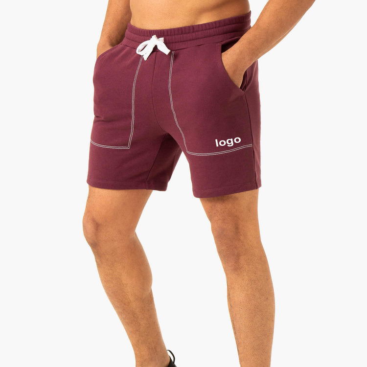 Pantalóns curtos deportivos OEM con cordón na cintura con costuras en contraste Pantalóns curtos de adestramento de ximnasia para homes